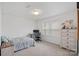 Neutral bedroom with bed, desk, dresser, and window that provides ample natural light at 7618 Fenn Way, Indian Land, SC 29707