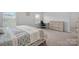 Bedroom featuring a desk, chair, and dresser with neutral colored walls and carpet floors with natural light from a window at 7618 Fenn Way, Indian Land, SC 29707