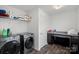 Functional laundry room with modern washer and dryer, storage and ironing station at 7618 Fenn Way, Indian Land, SC 29707