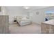 Main bedroom featuring neutral walls, carpet flooring, two windows providing natural light, and tasteful decor at 7618 Fenn Way, Indian Land, SC 29707