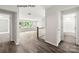 Spacious bonus room with wood-look floors, large windows, and private bath access at 1029 Wandsworth Pl # Ken0105, Charlotte, NC 28215