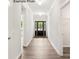 Bright entryway with dark hardwood floors and a dark brown front door at 1029 Wandsworth Pl # Ken0105, Charlotte, NC 28215