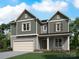 Two-story house with gray siding, white trim, and a two-car garage at 1029 Wandsworth Pl # Ken0105, Charlotte, NC 28215