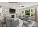 Living room features a fireplace and large windows at 1029 Wandsworth Pl # Ken0105, Charlotte, NC 28215