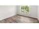 Simple office space with light gray walls and wood-look flooring at 1029 Wandsworth Pl # Ken0105, Charlotte, NC 28215