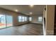 Spacious Gathering room with hardwood floors and sliding glass doors at 106 Obadiah Ct, Troutman, NC 28115