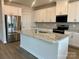 Kitchen island with granite countertop and stainless steel sink at 106 Obadiah Ct, Troutman, NC 28115