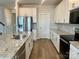 Modern kitchen with white cabinets, granite counters, and stainless steel appliances at 106 Obadiah Ct, Troutman, NC 28115