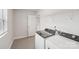Laundry room features washer and dryer with tile flooring at 106 Obadiah Ct, Troutman, NC 28115