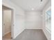 Walk-in closet features built-in shelving and neutral walls and carpet at 106 Obadiah Ct, Troutman, NC 28115