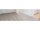 Neutral carpeted bedroom featuring base trim, electrical outlets, and an entry to a bath at 122 Satchel Ct, Troutman, NC 28115