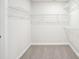 Walk-in closet with carpeted flooring and wire shelving for optimal storage space at 122 Satchel Ct, Troutman, NC 28115