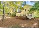 Large backyard featuring deck and mature trees surrounding the house at 3195 Hadden Hall Blvd, Fort Mill, SC 29715