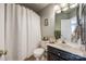 Cozy bathroom with a shower, framed art and sink with dark wood vanity at 3195 Hadden Hall Blvd, Fort Mill, SC 29715