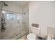 Tiled shower stall with glass door and toilet in the primary bathroom at 3195 Hadden Hall Blvd, Fort Mill, SC 29715