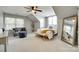 Cozy bedroom with vaulted ceilings, fan, and a comfortable seating area by the window at 3195 Hadden Hall Blvd, Fort Mill, SC 29715