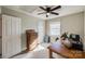 Bedroom with a ceiling fan, beige walls, a desk, and an antique dresser at 3195 Hadden Hall Blvd, Fort Mill, SC 29715