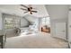 Sunlit bedroom features neutral carpet, a ceiling fan, and two windows at 3195 Hadden Hall Blvd, Fort Mill, SC 29715