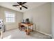 Bedroom with a ceiling fan, beige walls, and a desk with a computer on it at 3195 Hadden Hall Blvd, Fort Mill, SC 29715