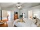 Bedroom featuring vaulted ceiling, white bedding, a dresser and plant in a neutral color palette at 3195 Hadden Hall Blvd, Fort Mill, SC 29715