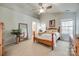 Bright bedroom features a vaulted ceiling, natural wood bed frame, and neutral color palette at 3195 Hadden Hall Blvd, Fort Mill, SC 29715