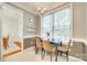 Cozy dining area featuring a modern light fixture, large window, and stylish decor on floating shelves at 3195 Hadden Hall Blvd, Fort Mill, SC 29715