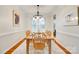 Formal dining room with wood floors, chandelier, and neutral wall color at 3195 Hadden Hall Blvd, Fort Mill, SC 29715