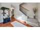 Elegant entryway featuring hardwood floors, staircase, and stylish decor at 3195 Hadden Hall Blvd, Fort Mill, SC 29715