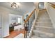 Welcoming foyer with hardwood floors, staircase, and a view into the adjacent living spaces at 3195 Hadden Hall Blvd, Fort Mill, SC 29715