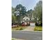 Inviting two-story home with attached garage, well-maintained lawn, and colorful azalea bushes at 3195 Hadden Hall Blvd, Fort Mill, SC 29715
