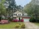Charming two-story home with a well-maintained front yard, flowering shrubs, and an attached garage at 3195 Hadden Hall Blvd, Fort Mill, SC 29715