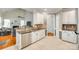 Modern kitchen with tile floor, stainless steel dishwasher, and views into the great room at 3195 Hadden Hall Blvd, Fort Mill, SC 29715