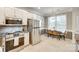 Eat-in kitchen with stainless appliances, tile floor, and attached breakfast nook at 3195 Hadden Hall Blvd, Fort Mill, SC 29715