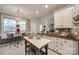 Bright eat-in kitchen features granite counters, stainless sink and modern lighting fixture at 3195 Hadden Hall Blvd, Fort Mill, SC 29715