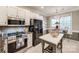 Updated kitchen with granite counters, stainless appliances, and island with seating at 3195 Hadden Hall Blvd, Fort Mill, SC 29715