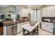 Open concept kitchen with granite counters, white cabinets, stainless appliances and decorative island at 3195 Hadden Hall Blvd, Fort Mill, SC 29715