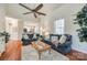 Comfortable living room with hardwood floors, ceiling fan, and cozy furnishings at 3195 Hadden Hall Blvd, Fort Mill, SC 29715