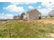 Exterior home view featuring a grassy yard with mature trees at 501 Ed Wilson Rd, Bessemer City, NC 28016