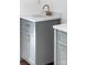 Bathroom features stylish, gray cabinets with elegant gold hardware and marble countertops at 501 Ed Wilson Rd, Bessemer City, NC 28016