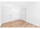A bright bedroom featuring a closet and wood-look flooring at 501 Ed Wilson Rd, Bessemer City, NC 28016