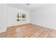Bright bedroom features wood-look flooring and a large window that brings in tons of natural light at 501 Ed Wilson Rd, Bessemer City, NC 28016