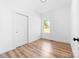 Bright bedroom featuring wood-look flooring, a window, and a closet at 501 Ed Wilson Rd, Bessemer City, NC 28016
