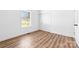 Bedroom with hardwood flooring and a closet under a window at 501 Ed Wilson Rd, Bessemer City, NC 28016