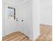 Bright entryway featuring a glass-paneled front door, complemented by hardwood floors and fresh white walls at 501 Ed Wilson Rd, Bessemer City, NC 28016