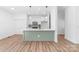 Modern kitchen design with shaker cabinets, stainless appliances, kitchen island and wood-look flooring at 501 Ed Wilson Rd, Bessemer City, NC 28016