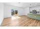 Open living space with wood-look floors and a sliding glass door leading to the outside at 501 Ed Wilson Rd, Bessemer City, NC 28016