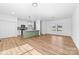 Spacious living space seamlessly connects the kitchen and living areas with wood-look floors and modern lighting at 501 Ed Wilson Rd, Bessemer City, NC 28016