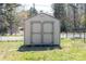 Close up view of a painted storage shed with double doors and a shingled roof at 501 Ed Wilson Rd, Bessemer City, NC 28016