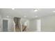 Finished basement showcasing carpeted stairs, recessed lighting, and painted walls at 5112 Heathland Dr # 75, Charlotte, NC 28215