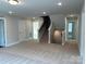 Spacious basement area with neutral carpet and staircase to the upper level at 5112 Heathland Dr # 75, Charlotte, NC 28215